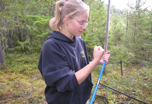 Student collecting data in field