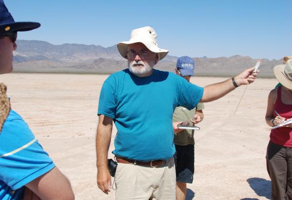 Reid Kreutswizer giving a lecture in the desert