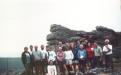 Group shot in front of big rock