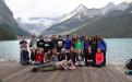 Class of 2013 on wood deck with mountains and lake